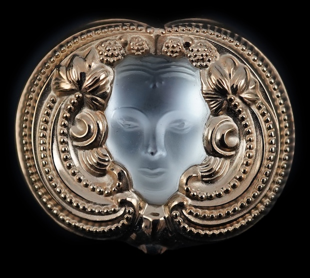 A Lalique mask brooch, cased